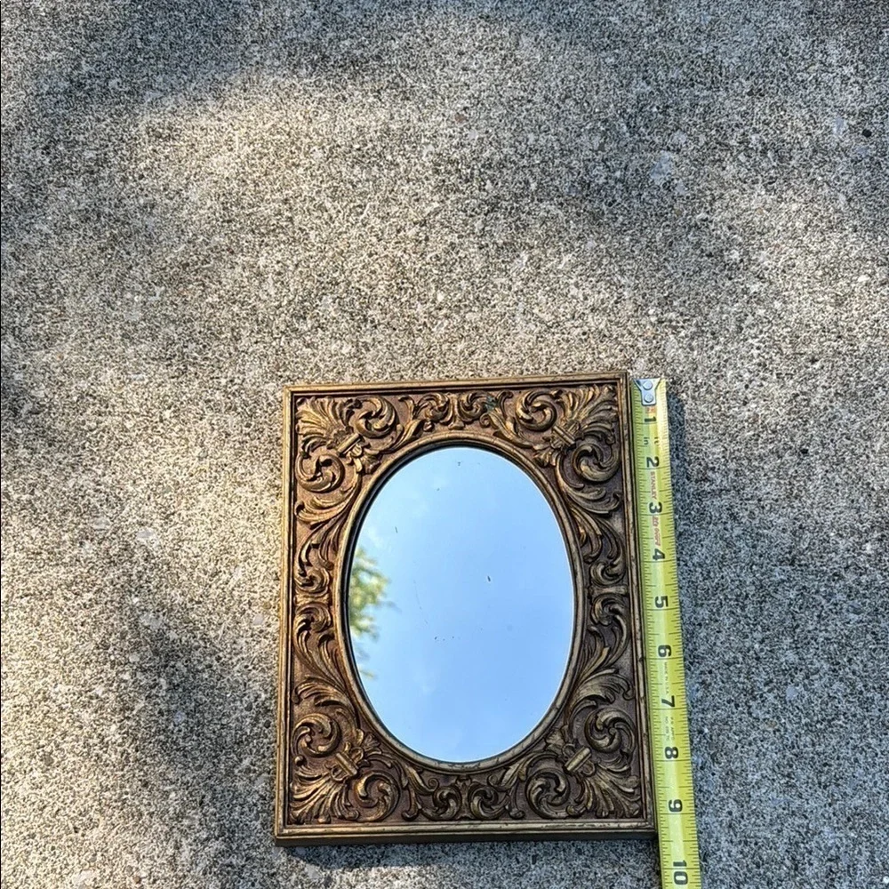 Gold Ornate Mirror with Intricate Scrollwork